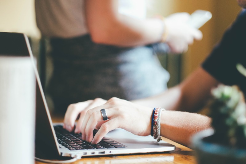 Hands on a laptop