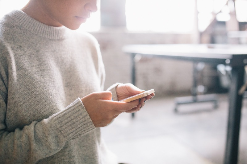 Hands Holding a Smartphone