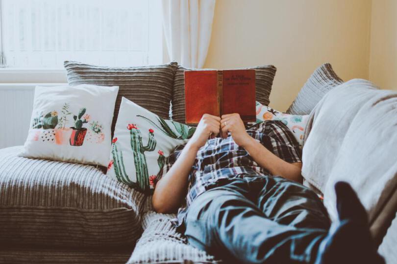 person lying on a sofa